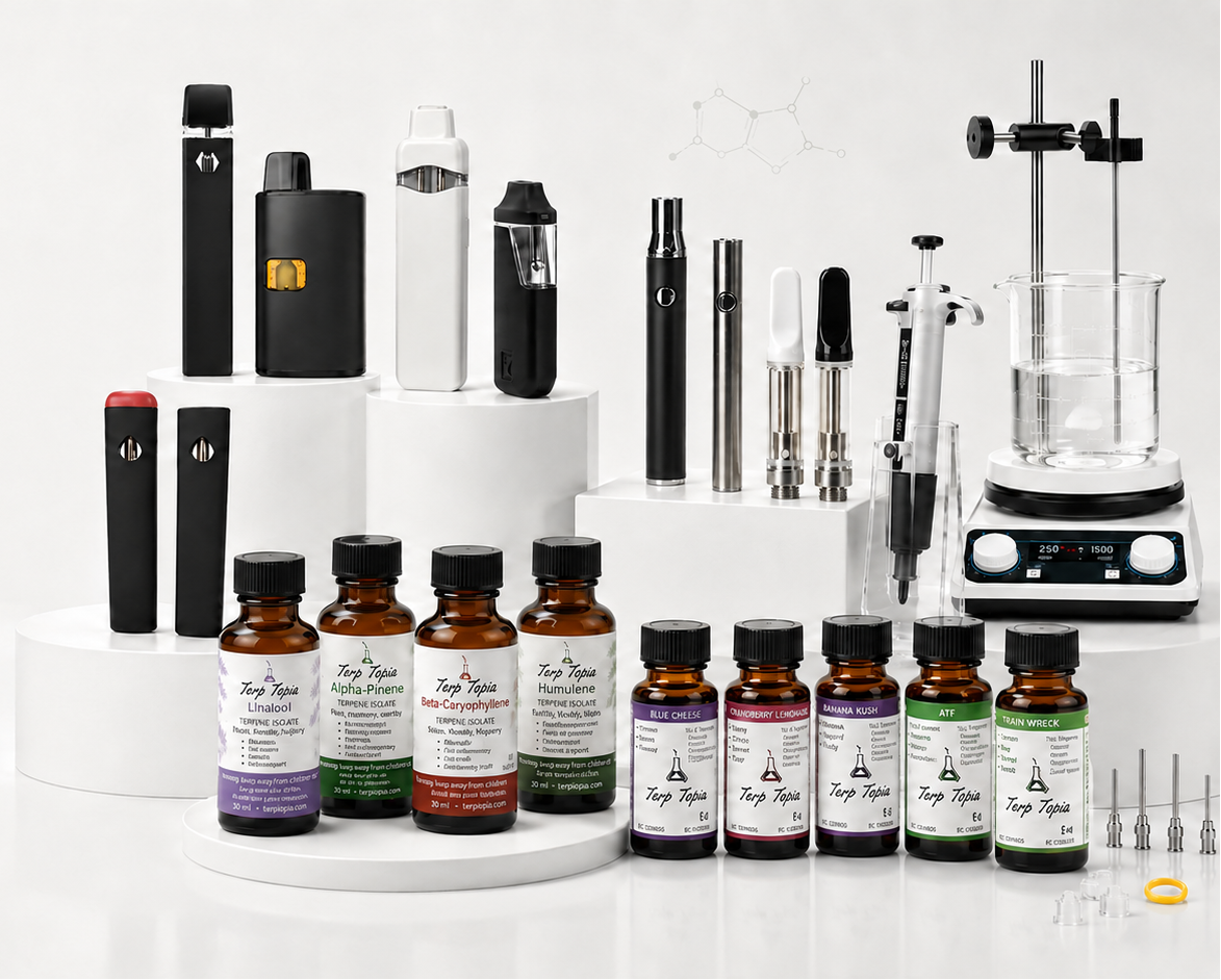 A collection of vape devices and small amber bottles with labels arranged on white display pedestals against a clean white studio background. The products include several black and white vape units and multiple amber bottles with different colored labels.